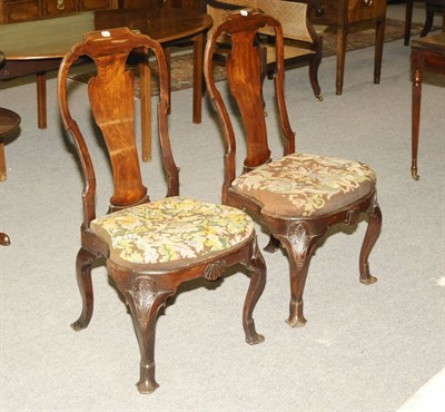 Lot 1501 - A Pair of Queen Anne Walnut Dining Chairs, the shaped top rails and splats above needlework drop-in