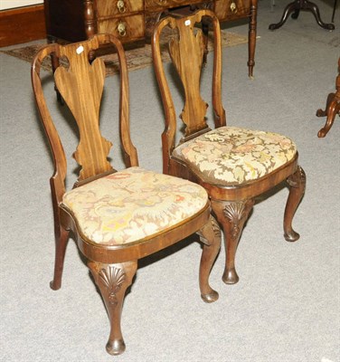 Lot 1502 - A Pair of Queen Anne Walnut Dining Chairs, the heart shaped splats above drop-in seats and...