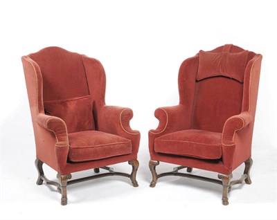 Lot 1509 - A Pair of  Wing Back Armchairs in the George I Manner, upholstered in red velvet, the wavy...