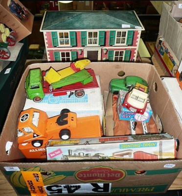 Lot 58 - A Collection of Tinplate Toys, including a Mettoy two storey house, Europa Cup football game, boxed