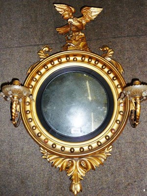 Lot 1514 - A Regency Gilt and Gesso Two-Branch Girandole, the circular convex mirror contained within a reeded