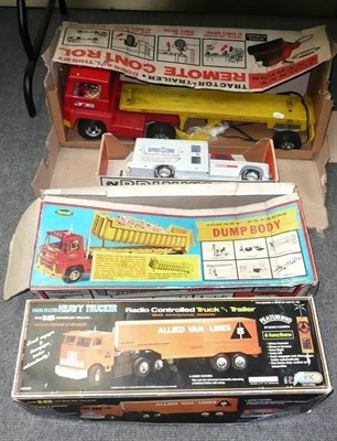 Lot 130 - Four Large Boxed Plastic Trucks:- Johnny Express remote control tractor trailer; Johnny Express...