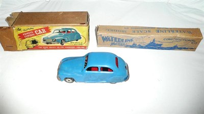 Lot 131 - A Boxed Chad Valley Remote Control Car, in blue tinplate, with rubber controller and key; A...