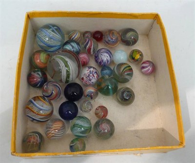 Lot 134 - Twenty Nine 19th Century Hand Blown Marbles, including a 4cm multiswirl with lattice work...