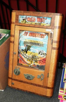 Lot 154 - A Wooden Wall Mounted Allwin Type 'Wild West' Spin a Win Amusement Machine by Parkers of Rhyl, with