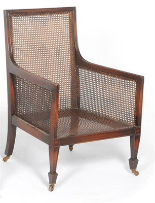 Lot 1521 - A Mahogany Bergere , with caned back, sides and seat, the moulded frame raised on square...