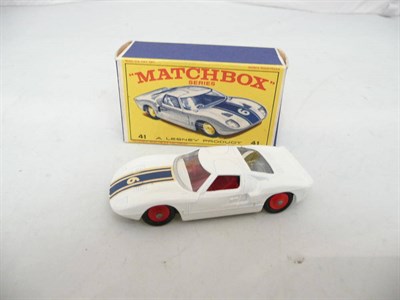 Lot 186 - A Boxed Matchbox 1 - 75 Series Ford G.T. Racing Car No.41, with white body, red hubs and...