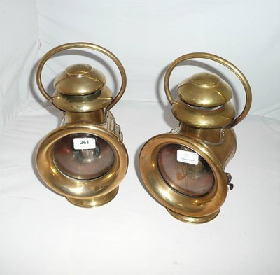 Lot 261 - A Pair of English Brass 'Camelinat' Carbide Car Lamps, with hooped handles, two-tier domed...