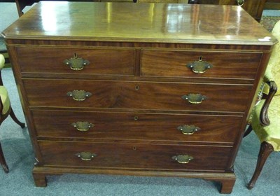 Lot 1531 - A George III Mahogany Chest of Drawers, the moulded top over a strung frieze and two short and...