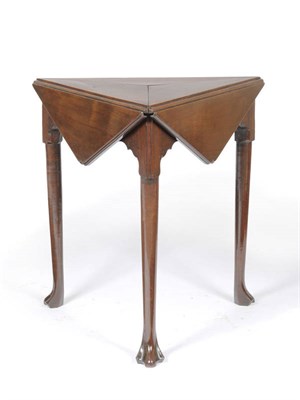 Lot 1540 - A George II Mahogany Triangular Section Dropleaf Table, the segmented top with three drop...