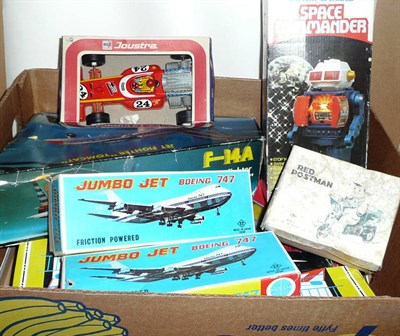 Lot 76 - Nine Boxed Tinplate and Plastic Toys, including two Russian friction operated space rockets,...