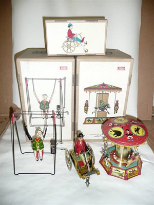 Lot 81 - Three Boxed Limited Edition Reproduction Paya Clockwork Tinplate Toys:- Clown Trapeze Artist;...