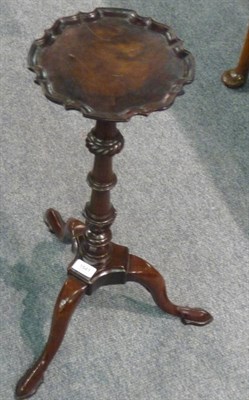 Lot 1541 - A Mahogany Candlestand, with circular pie crust edge, raised on a lobed and turned baluster...