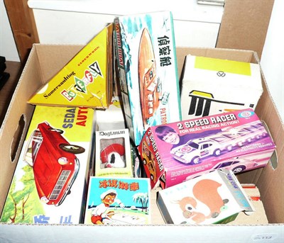 Lot 84 - Twelve Boxed Tinplate and Plastic Toys, including Japanese mechanical Missile Tank, Japanese...