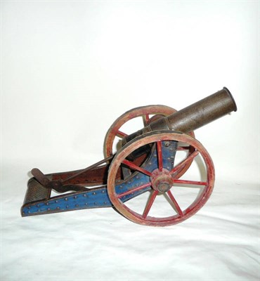 Lot 87 - A Large German Tinplate Field Gun, with 'DRGM' trademark, wooden spoked wheels and wide barrel.