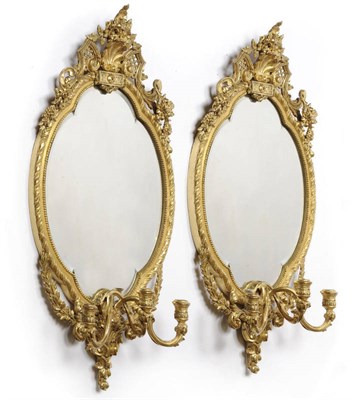 Lot 1542 - A Pair of 19th Century Gilt and Composition Three-Branch Girandoles, the oval bevelled glass plates