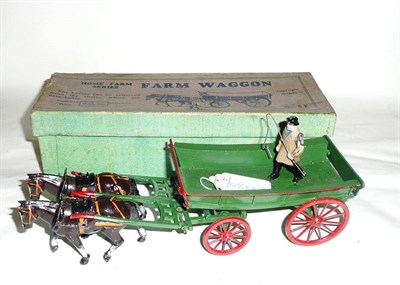 Lot 102 - A Boxed Britains Home Farm Series Farm Wagon No.5F, the green cart with red wheels and...