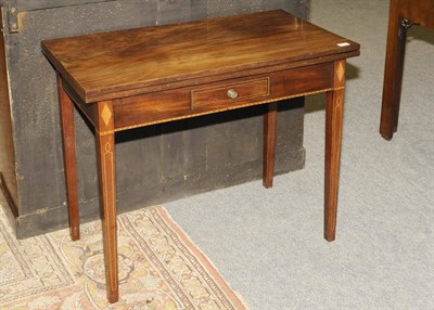 Lot 1549 - A George III Mahogany, Ebony and Boxwood Strung Tea Table, the rectangular folding top with...