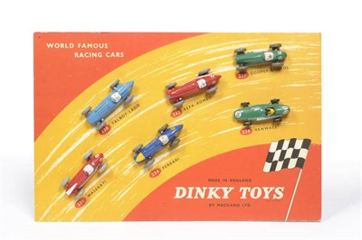 Lot 193 - A Dinky 'World Famous Racing Cars' Shop Display Advertising Showcard, in red with brown track...