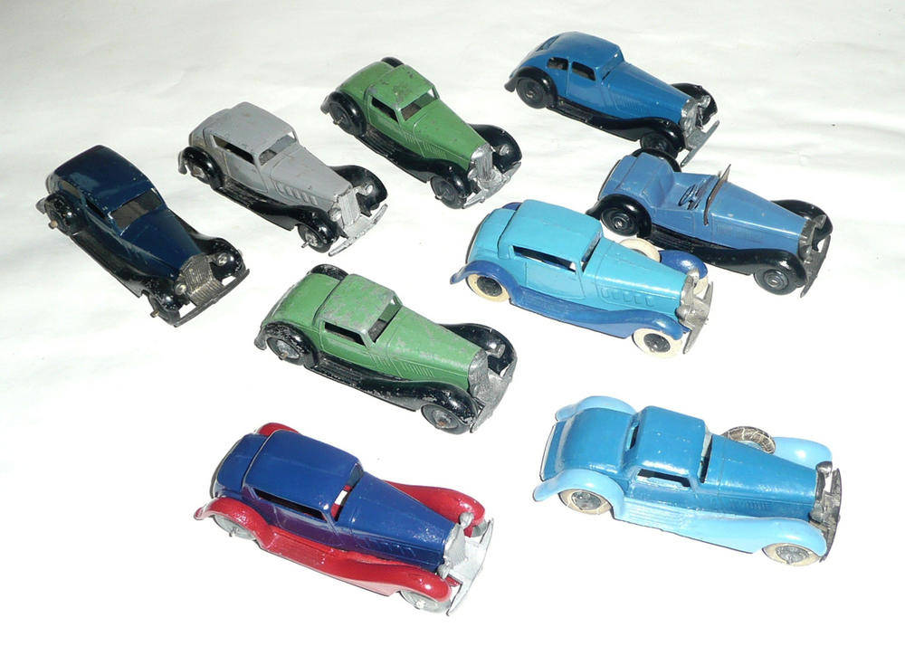 Lot 200 - Nine Early Dinky Cars, both pre war and