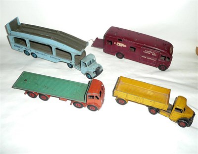 Lot 213 - Four Dinky Supertoys Commercial Vehicles:- Foden Flat Truck with orange cab and chassis, green back