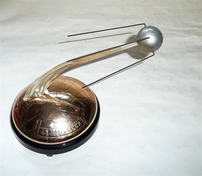 Lot 217 - A Novelty Russian Clockwork Musical Model Commemorating The Launch of Sputnik 1957, in metal...