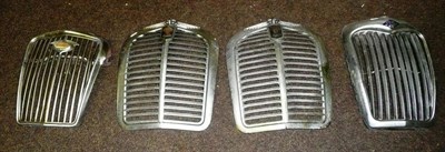 Lot 222 - Four Chrome Car Radiator Grilles - Wolseley, Riley and two Austin, all with badges.