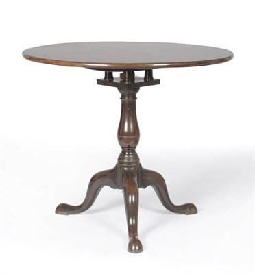 Lot 1555 - A George III Mahogany Flip Top Pedestal Table, the circular top raised on a baluster bird cage...