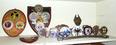 Lot 237 - A Collection of Enamelled Car Badges, including seven German badges on a chrome strip, three German