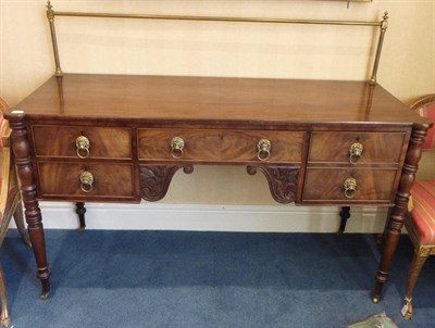 Lot 1559 - A George IV Mahogany Sideboard, the rectangular top with brass gallery above a central frieze...