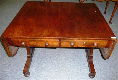 Lot 1560 - An Early Victorian Mahogany Sofa Table, the rectangular top with two hinged leaves above two frieze