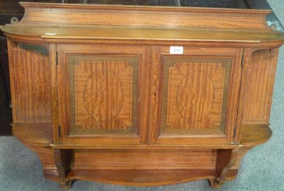 Lot 1565 - A Late 19th Century Satinwood Wall Cabinet, the shaped top with arched back above a pair of...