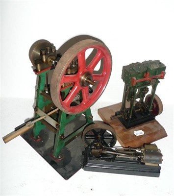 Lot 75 - Three Stationary Steam Engines:- a twin cylinder marine engine with solid flywheel, on a...
