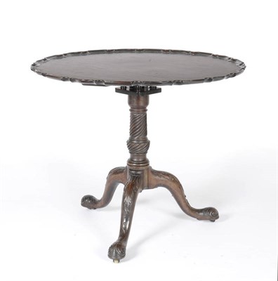 Lot 1566 - A George III and Later Mahogany Pedestal Table, the circular pie crust top raised on a baluster...