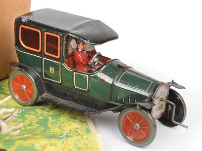 Lot 86 - A German Tinplate Fly Wheel Drive Chauffeur Driven 'Hessmobile' No.1022 Limousine, lithographed...