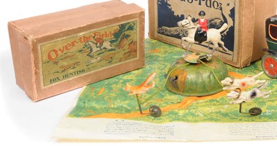 Lot 89 - A Japanese Clockwork Tinplate and Celluloid Fox Hunting Toy 'Over the Fields' by Alpstoy Co,...