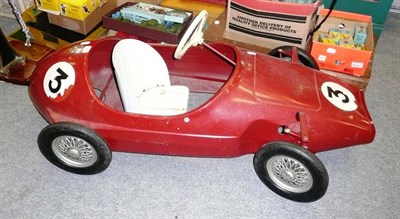 Lot 93 - A Tri-ang Tinplate Pedal Racing Car, in maroon, with silver exhaust, racing number 3, white...