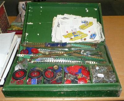 Lot 98 - A Meccano No.9 Outfit, containing a quantity of pieces in red, green, blue check, gold etc., in...