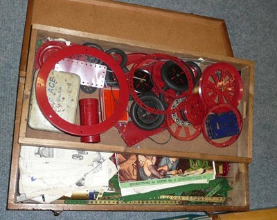 Lot 105 - A Collection of Meccano, in green, red, gold and blue check, including cogs, wheels, clockwork...