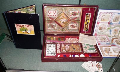 Lot 151 - A French Games Compendium by Jombart, Paris, the folding wooden leather cloth covered box with...