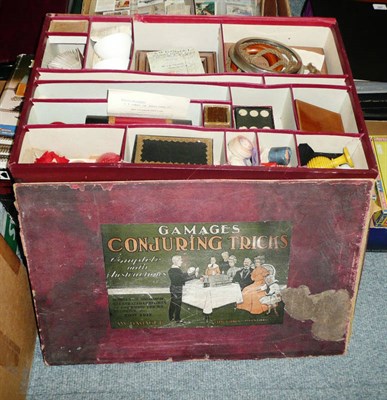 Lot 154 - An Early Gamages Conjuring Tricks Set, in original compartmentalised box with pictorial label,...