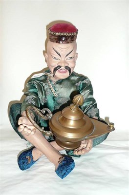 Lot 159 - An Aladdin Automaton, the clockwork composition figure in seated position wearing silk...