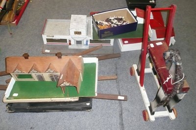 Lot 170 - Wooden Toys, comprising a garage, a farmyard with buildings, a ranch, a blackboard, a pull...