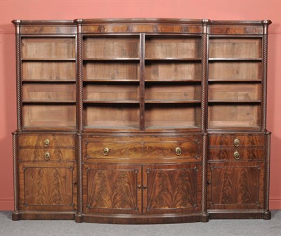 Lot 1576 - A William IV Mahogany Secretaire Breakfront Bookcase, the moulded cornice above a plain frieze with