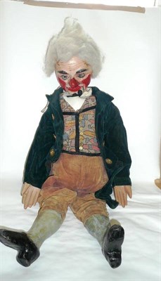 Lot 180 - An Early Ventriloquist's Dummy, with papier mache head and legs, wooden hands, white hair, blue...