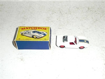 Lot 212 - A Boxed Matchbox 1 - 75 Series Ford G.T. Racing Car No.41, in white with red hubs and interior,...