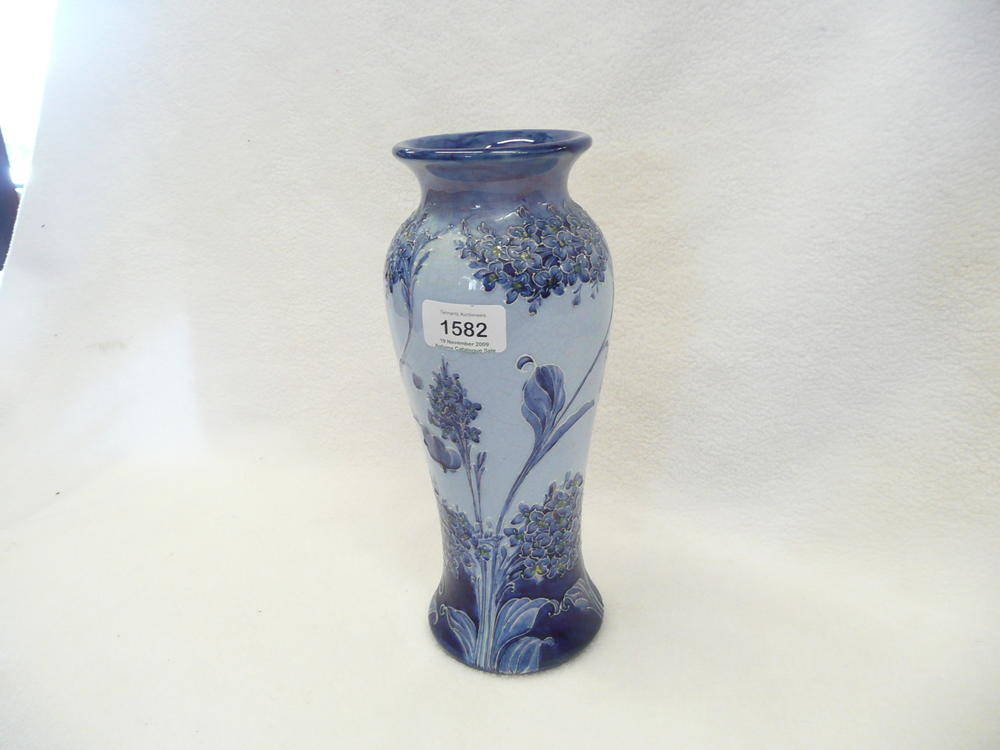 Lot 1582 - A William Moorcroft Florian Ware "Lilac" Vase, in shades of blue, painted green signature and...