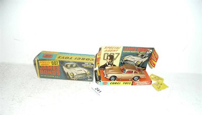 Lot 241 - A Boxed Corgi James Bond's Aston Martin D.B.5 No.261, in gold, with two passengers, stickers,...