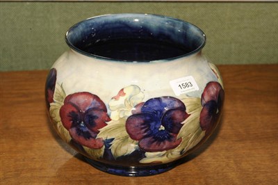 Lot 1583 - A William Moorcroft "Pansy" Jardiniere, on a blue wash and dark blue ground, impressed factory...