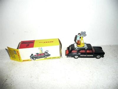 Lot 251 - A Boxed Dinky Pathe News Camera Car No.281, in black with red interior, cameraman with brown...